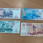 В Волжском мужчина отправил младшего брата с фальшивыми купюрами по магазинам